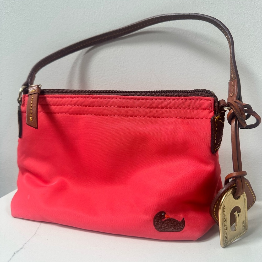 Dooney & Bourke Coral Nylon Wristlet with Brown Trim and leather and brass tag